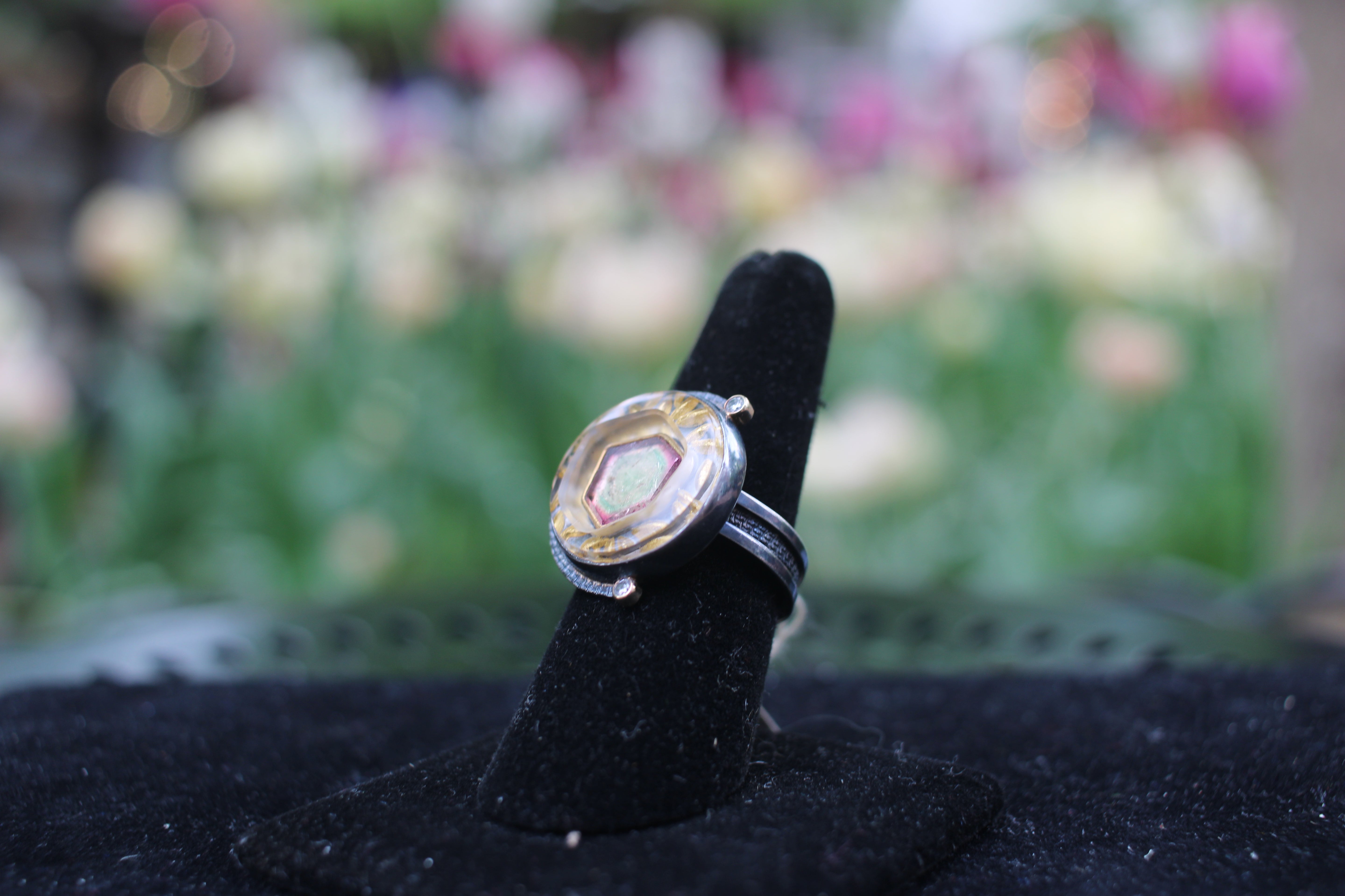 Watermelon Tourmaline surrounded by gold carved quartz