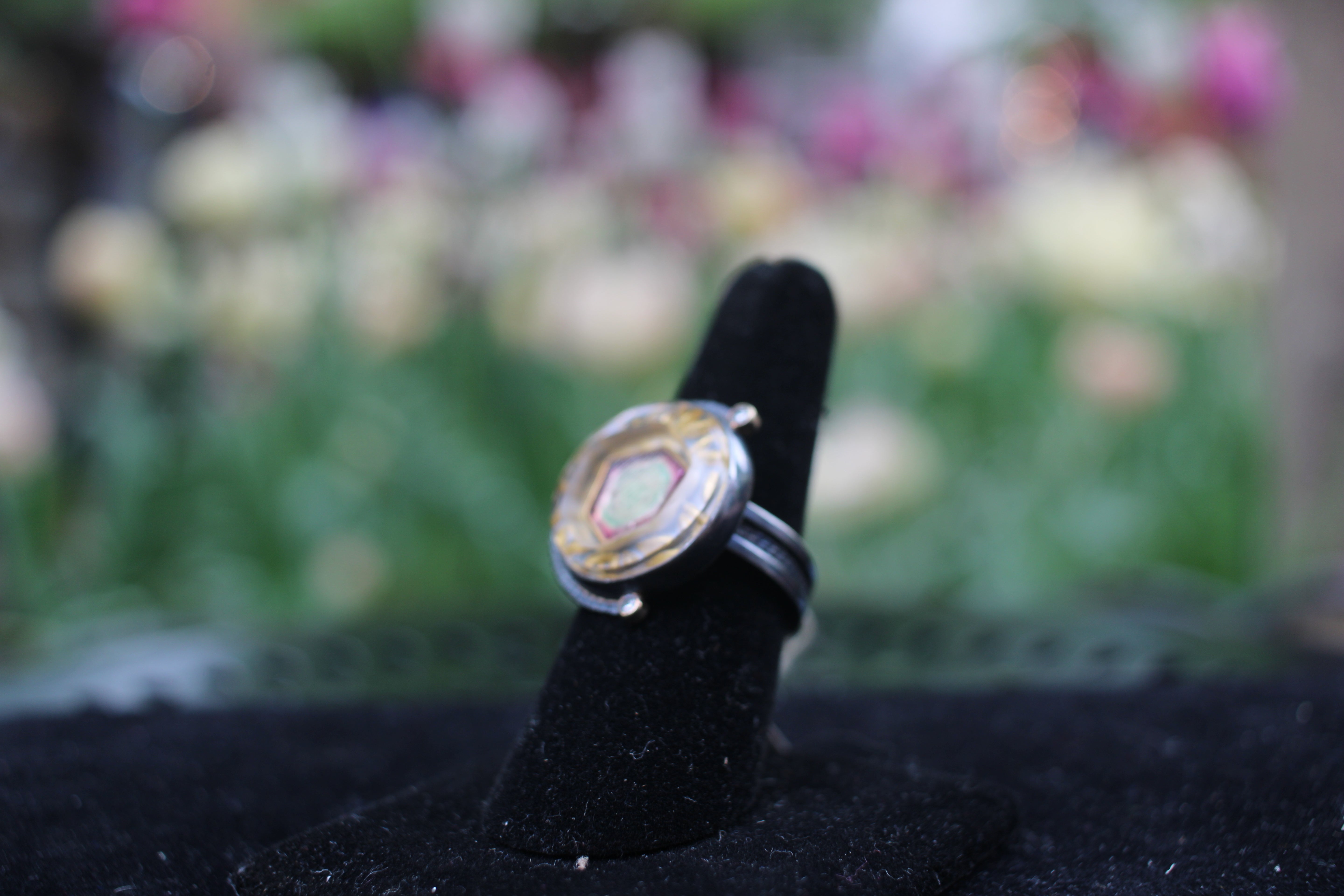 Watermelon Tourmaline surrounded by gold carved quartz