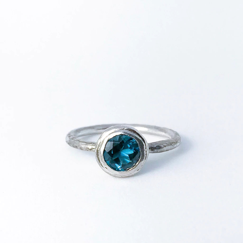 Bezel Pebble Blue Topaz Ring